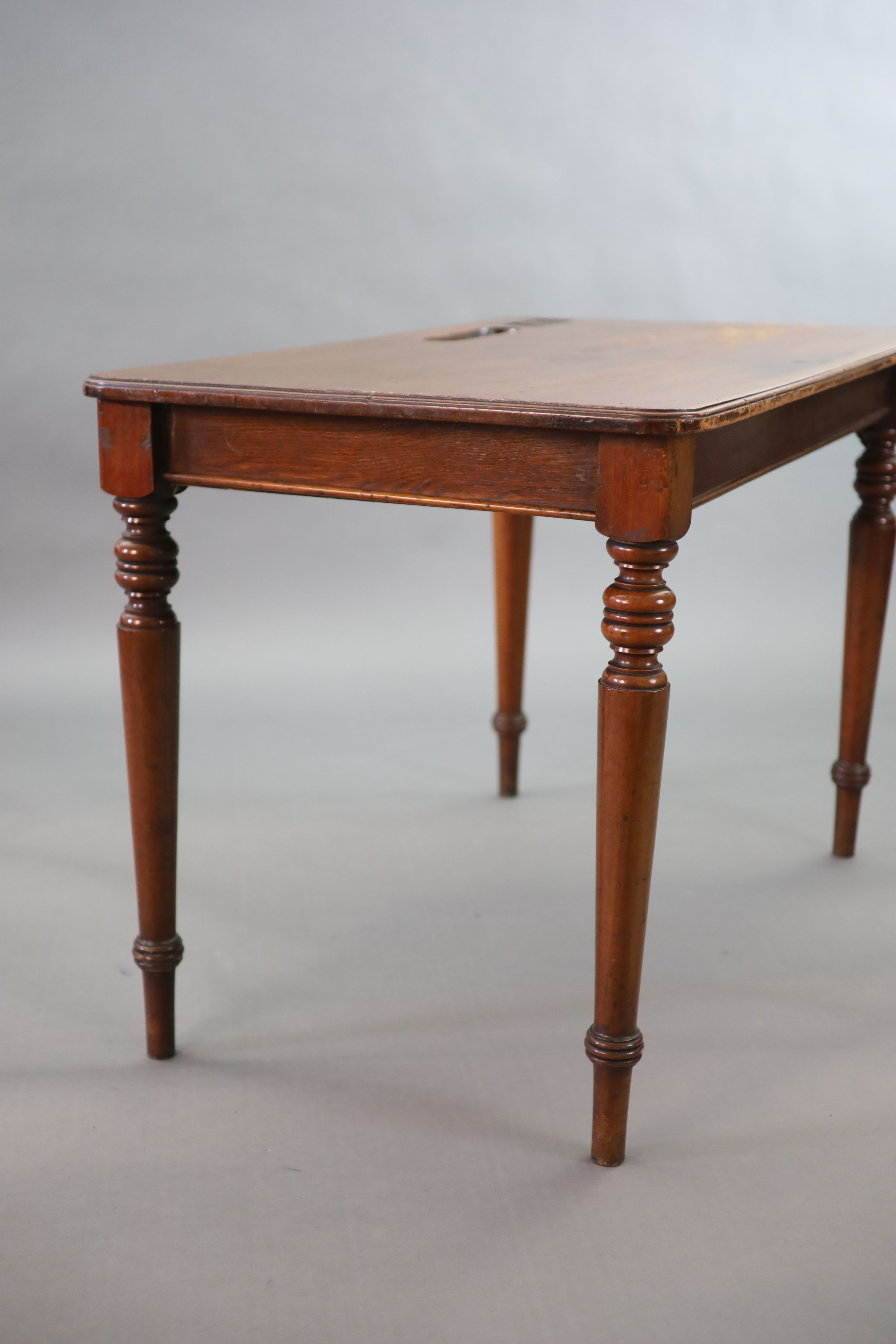 A pair of late Victorian mahogany writing tables, W.112cm D.68cm H.77.5cm